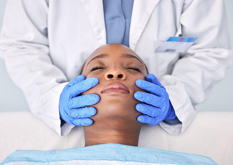 massage-hands-and-a-skin-analysis-on-a-black-woma-2023-11-27-05-09-05-utc